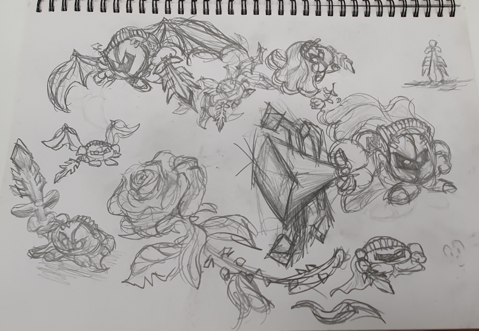 a photo of a page from a sketchbook with some pencil drawings of a small orb shaped creature with a metal mask, cape, wings and a detailed sword. Also includes an observational sketch of a rose.